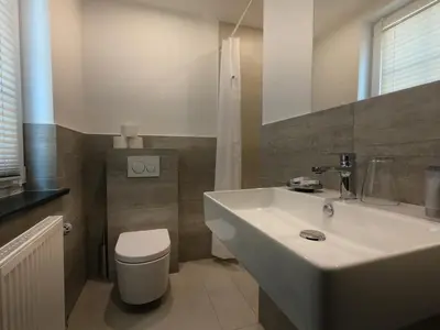 Ein Badezimmer in der Unterkunft Hotel Langhans