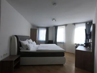 Ein Bett oder Betten in einem Zimmer der Unterkunft Hotel Langhans