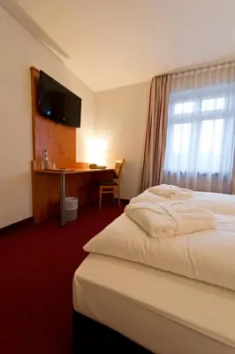 Ein Bett oder Betten in einem Zimmer der Unterkunft Hotel Neuwirtshaus