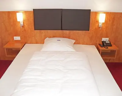 Ein Bett oder Betten in einem Zimmer der Unterkunft Hotel Neuwirtshaus