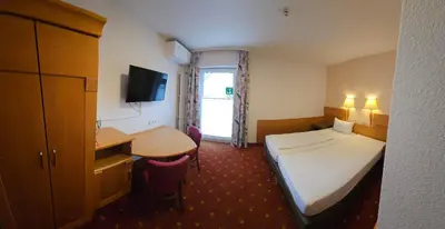 Ein Bett oder Betten in einem Zimmer der Unterkunft Hotel Altes Weinhaus
