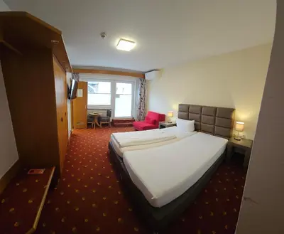 Ein Bett oder Betten in einem Zimmer der Unterkunft Hotel Altes Weinhaus