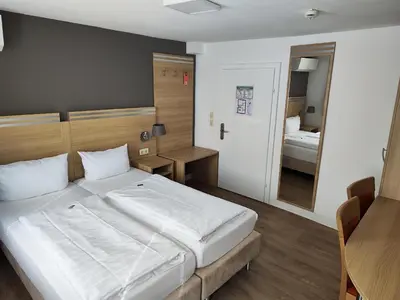 Ein Bett oder Betten in einem Zimmer der Unterkunft Hotel Altes Weinhaus