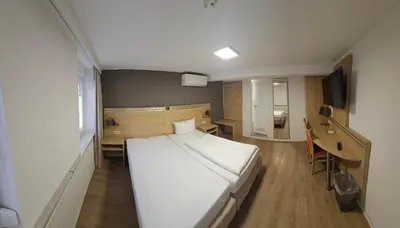 Ein Bett oder Betten in einem Zimmer der Unterkunft Hotel Altes Weinhaus