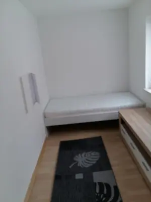 Ein Bett oder Betten in einem Zimmer der Unterkunft Ferienwohnung Peter Hofling