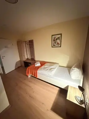 Ein Bett oder Betten in einem Zimmer der Unterkunft Hotel Deutscher Hof