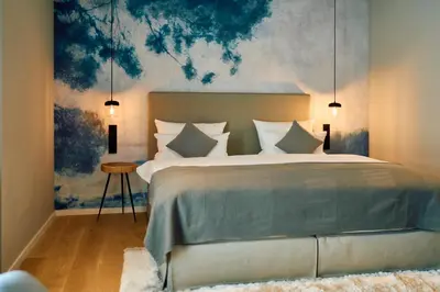 Ein Bett oder Betten in einem Zimmer der Unterkunft Hofgut Wißberg - Das Weinberghotel
