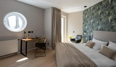 Ein Bett oder Betten in einem Zimmer der Unterkunft Hofgut Wißberg - Das Weinberghotel