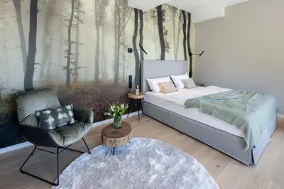 Ein Bett oder Betten in einem Zimmer der Unterkunft Hofgut Wißberg - Das Weinberghotel