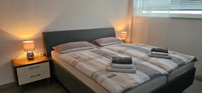 Ein Bett oder Betten in einem Zimmer der Unterkunft Ferienwohnung Buchberg Exklusiv