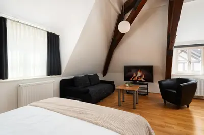 TV/Unterhaltungsangebot in der Unterkunft Hotel CampusZwei Komfortable Doppelzimmer & Apartments mit Küche Zentral in Ludwigsburg ideal für Business & Langzeitaufenthalte 24h Check in Kinder bis 14 Jahre übernachten kostenlos