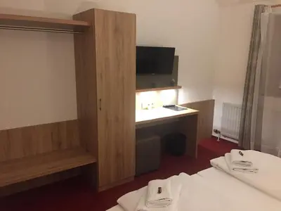 Ein Bett oder Betten in einem Zimmer der Unterkunft Vico's Hotel & Restaurant Asperg