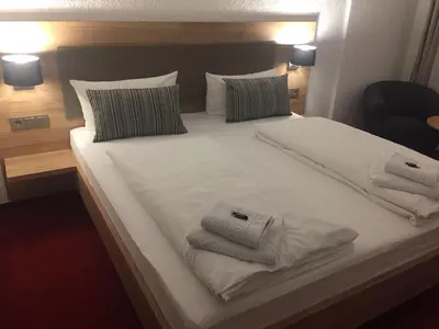 Ein Bett oder Betten in einem Zimmer der Unterkunft Vico's Hotel & Restaurant Asperg