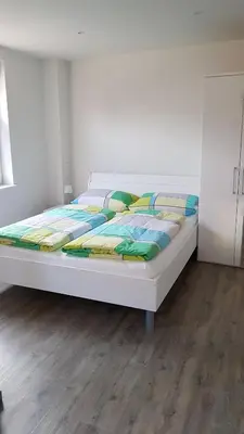 Ein Bett oder Betten in einem Zimmer der Unterkunft Boardinghouse Waldbronn