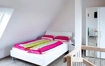 Ein Bett oder Betten in einem Zimmer der Unterkunft Boardinghouse Waldbronn