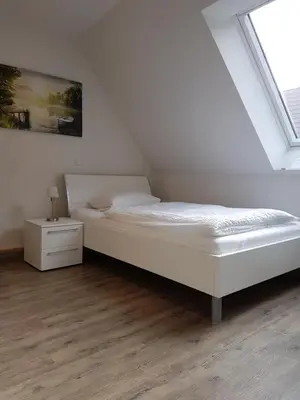 Ein Bett oder Betten in einem Zimmer der Unterkunft Boardinghouse Waldbronn