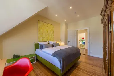 Ein Bett oder Betten in einem Zimmer der Unterkunft Zweite Heimat Heidelberg