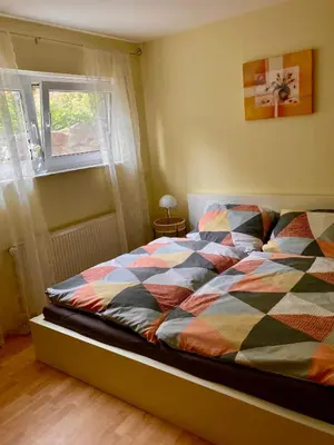 Ein Bett oder Betten in einem Zimmer der Unterkunft Ferienwohnung in Hahnheim, Rheinhessen