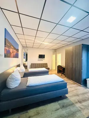Ein Bett oder Betten in einem Zimmer der Unterkunft Looks Inn