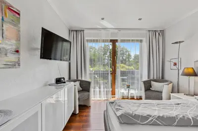 Ein Bett oder Betten in einem Zimmer der Unterkunft Belisima Apartments I Ferienwohnungen Deidesheim I Deutsche Weinstraße I Individuell mit Charm I Ruhig am Kurpark I Nähe Supermarkt - Bäcker - Bahnhof