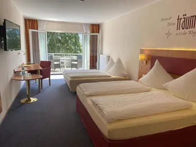 Ein Bett oder Betten in einem Zimmer der Unterkunft Hotel Häfner