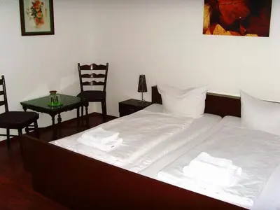 Ein Bett oder Betten in einem Zimmer der Unterkunft Hotel Schlossberg