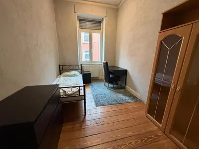 Ein Sitzbereich in der Unterkunft Zimmer in Kaiserslautern