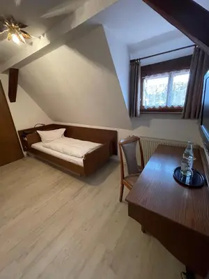 Ein Bett oder Betten in einem Zimmer der Unterkunft Landhotel Sickinger Hof