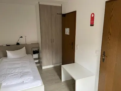 Ein Bett oder Betten in einem Zimmer der Unterkunft Landhotel Sickinger Hof