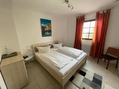 Ein Bett oder Betten in einem Zimmer der Unterkunft Landhotel Sickinger Hof