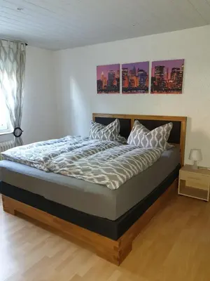 Ein Bett oder Betten in einem Zimmer der Unterkunft Ferienwohnung Mörlenbach