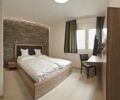 Ein Bett oder Betten in einem Zimmer der Unterkunft Hotel Maxis - digitaler Self-check-in -