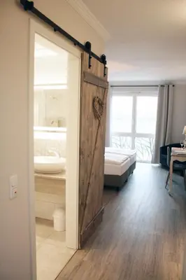 Ein Bett oder Betten in einem Zimmer der Unterkunft Winzerhotel Trautwein