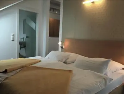 Ein Bett oder Betten in einem Zimmer der Unterkunft Hotel Kurpfalz