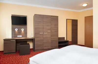 Ein Bett oder Betten in einem Zimmer der Unterkunft ates Hotel Lampertheim by AURUM