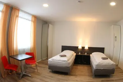 Ein Bett oder Betten in einem Zimmer der Unterkunft looks-inn