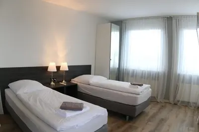 Ein Bett oder Betten in einem Zimmer der Unterkunft looks-inn