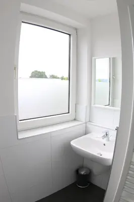 Ein Badezimmer in der Unterkunft looks-inn