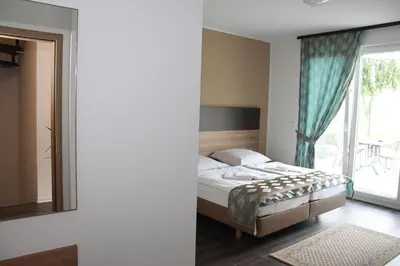 Ein Bett oder Betten in einem Zimmer der Unterkunft Hotel Pizzeria Da Beni