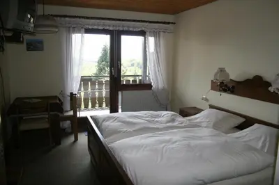 Ein Bett oder Betten in einem Zimmer der Unterkunft Gasthof Siller