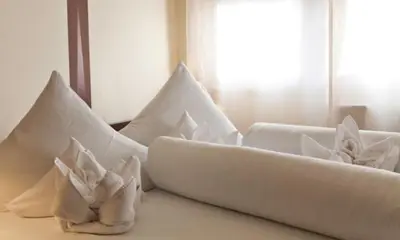 Ein Bett oder Betten in einem Zimmer der Unterkunft Hotel Riviera