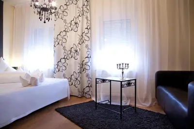 Ein Bett oder Betten in einem Zimmer der Unterkunft Hotel Riviera