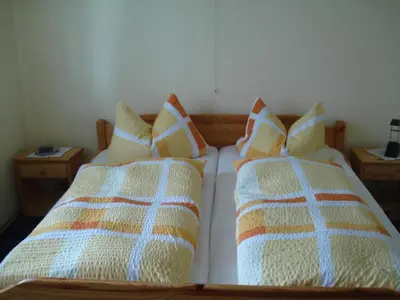 Ein Bett oder Betten in einem Zimmer der Unterkunft Gästehaus Kiefer