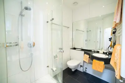 Ein Badezimmer in der Unterkunft Hotel-Pension Berger