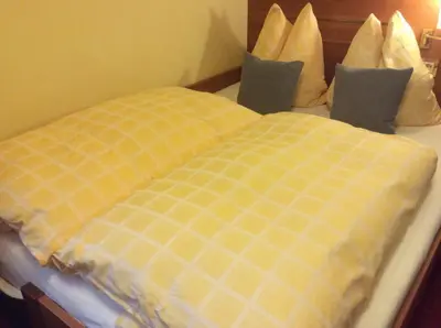 Ein Bett oder Betten in einem Zimmer der Unterkunft Hotel-Pension Berger