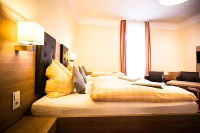 Ein Bett oder Betten in einem Zimmer der Unterkunft Hotel-Pension Berger