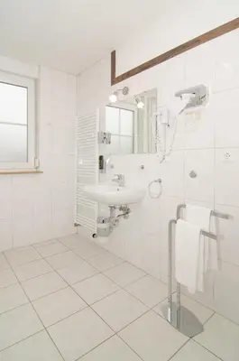 Ein Badezimmer in der Unterkunft Hotel -Restaurant Taormina