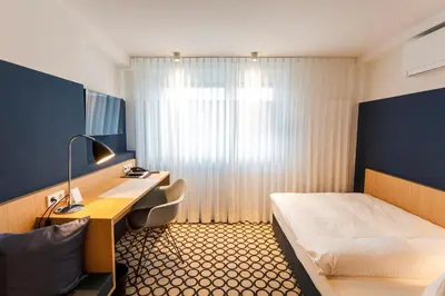 Ein Bett oder Betten in einem Zimmer der Unterkunft Hotel Otterbach