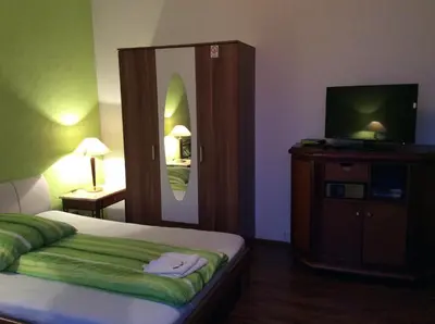 Ein Bett oder Betten in einem Zimmer der Unterkunft Hotel Feiertag
