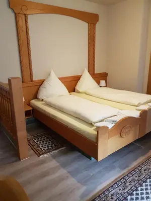 Ein Bett oder Betten in einem Zimmer der Unterkunft Hotel Paelzer Buwe